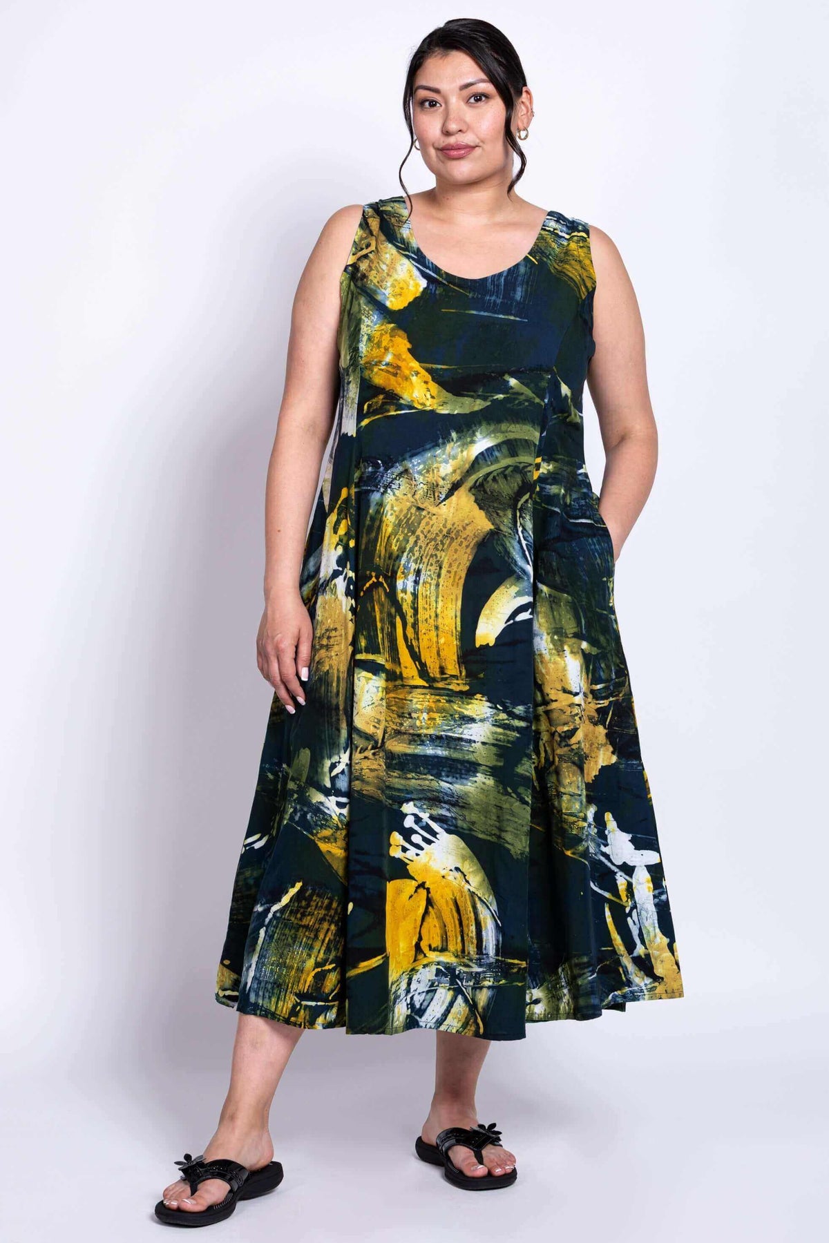 Front three-quarter view showing the Sara summer dress with pockets and flowing silhouette