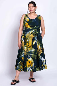 Front three-quarter view showing the Sara summer dress with pockets and flowing silhouette