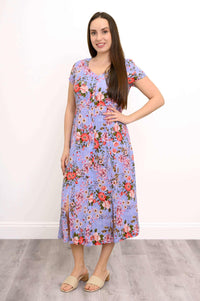 Three-quarter front pose of woman in Morgan floral dress showcasing fit and front placket