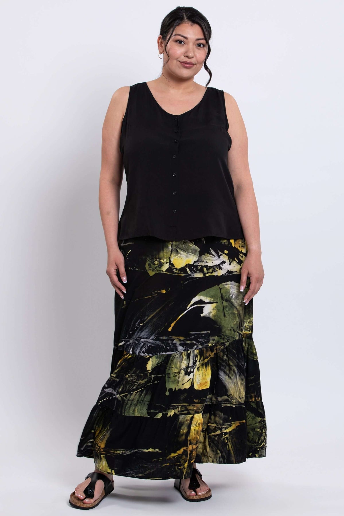Three-quarter view of Tibby summer skirt with model showing ankle-length tiered design
