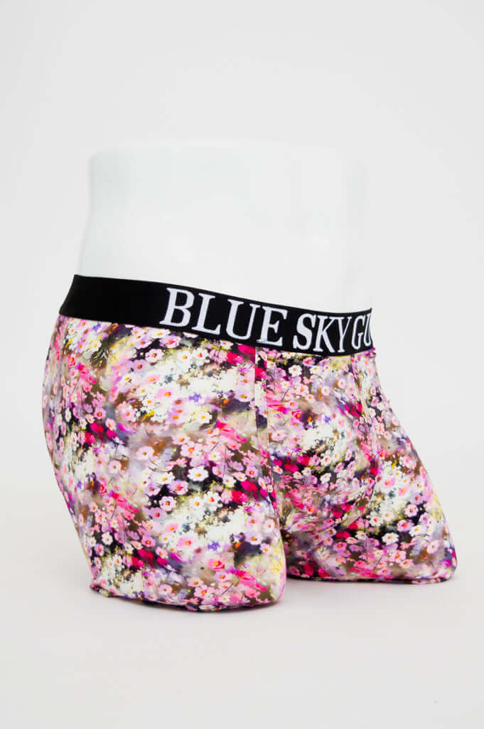 Three-quarter view of floral print men's boxer briefs with supportive waistband