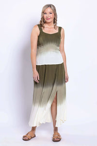 Three-quarter view of model in olive ombre tank top and skirt with leg slit