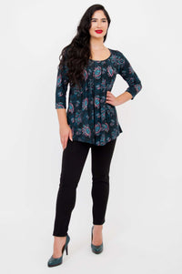 Three-quarter view of model in Peyton Top showing pleated detail and A-line shape