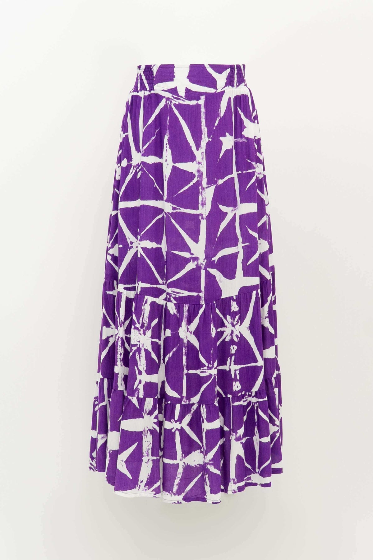 Front view of the Tibby summer skirt in purple and white batik print