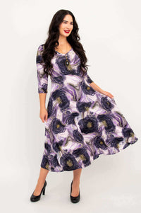 Woman twirling in the Soul Dress with purple marble pattern