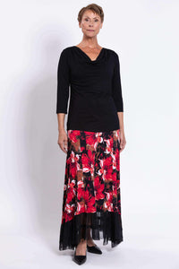 Woman posing in black top and red floral Vera Maxi Skirt with sheer black mesh hem