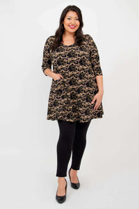 Full body view of model in Veronica A-Line Tunic with black leggings