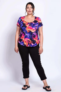 Model in Ritzy Short Sleeve Top showing relaxed fit and vivid abstract print
