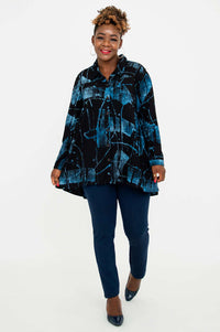 Walking front view of woman in Peruva flowy top, blue abstract print