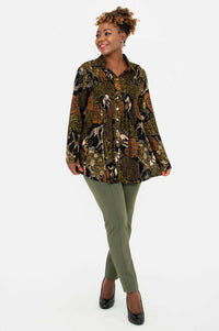 Model walking in Cindy safari print tunic paired with olive pants