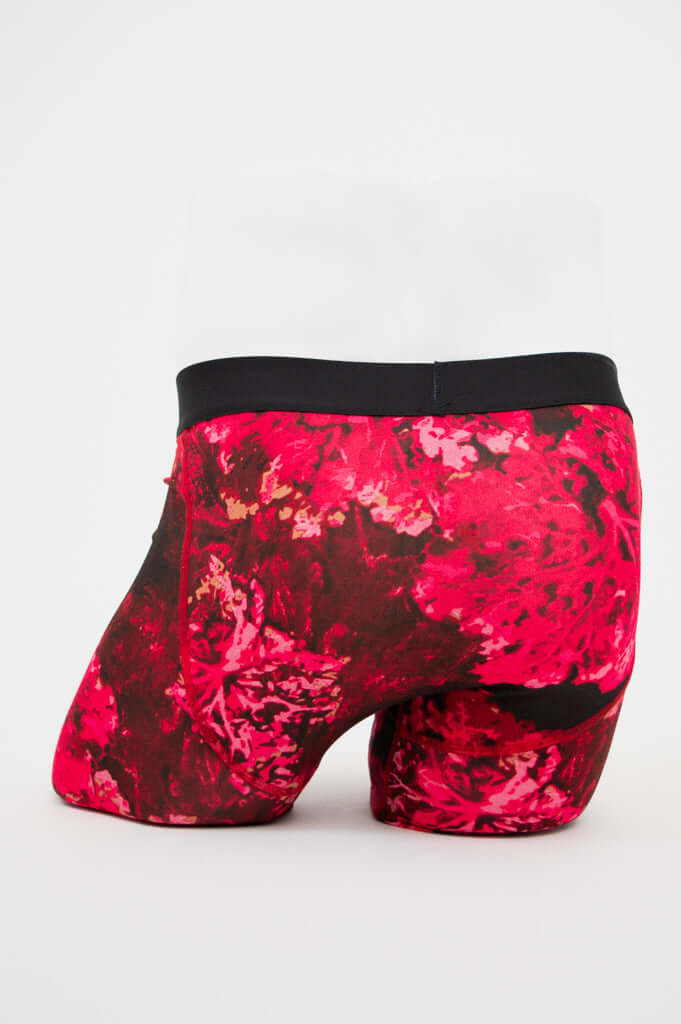 Back view of men's boxer briefs with striking coral-inspired red floral pattern