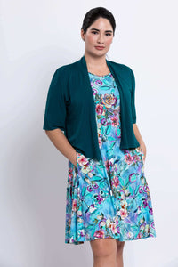 Willow Floral Aqua Dress with teal cardigan, hands in pockets