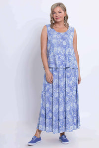 Full body view of a woman in the Ginny Tank and matching blue floral skirt