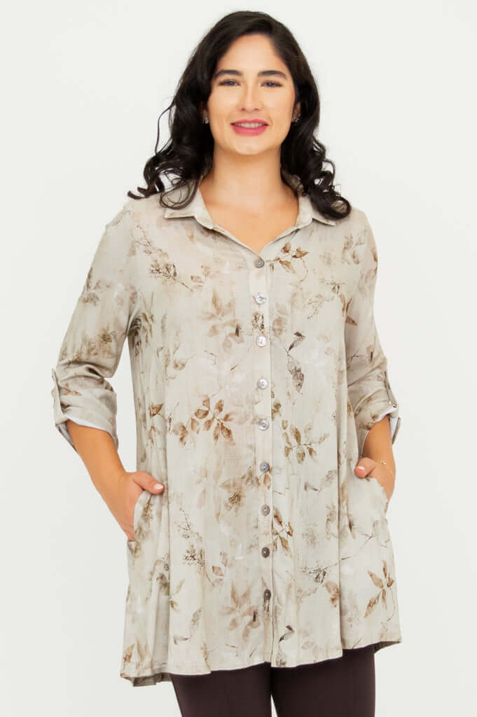 Front view of woman wearing oversized floral bamboo linen tunic with pockets