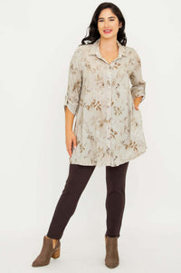 Woman in bamboo linen tunic and brown pants standing with relaxed posture