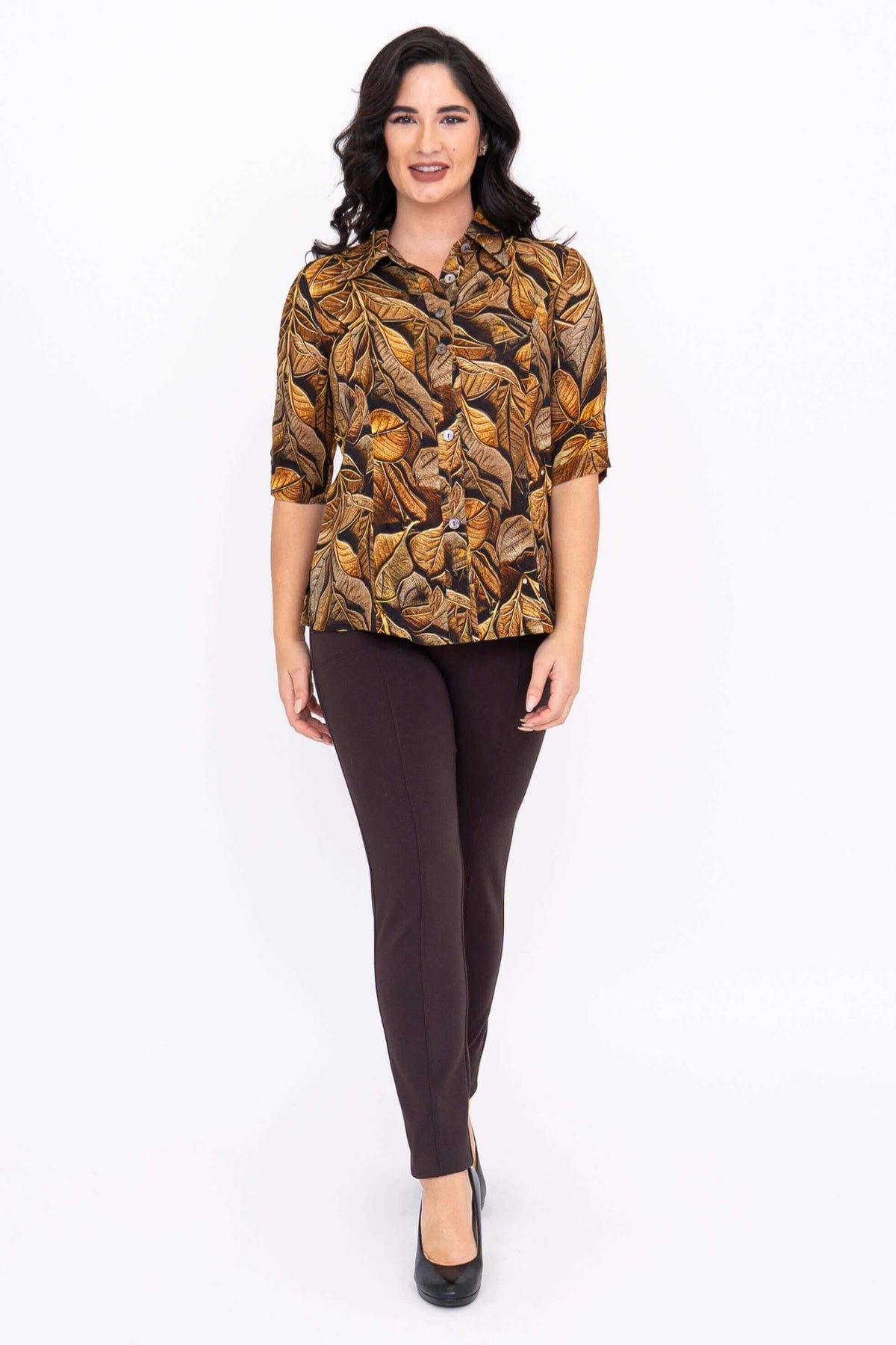 Woman in leaf print bamboo-linen blouse walking forward, front view
