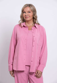 Woman modeling pink linen-blend shirt with long sleeves and front pocket