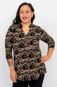 Woman wearing the Edwina bamboo top with gold filigree pattern, front view