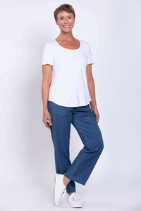 Woman wearing Marla Tencel Pants styled with a white t-shirt and sneakers