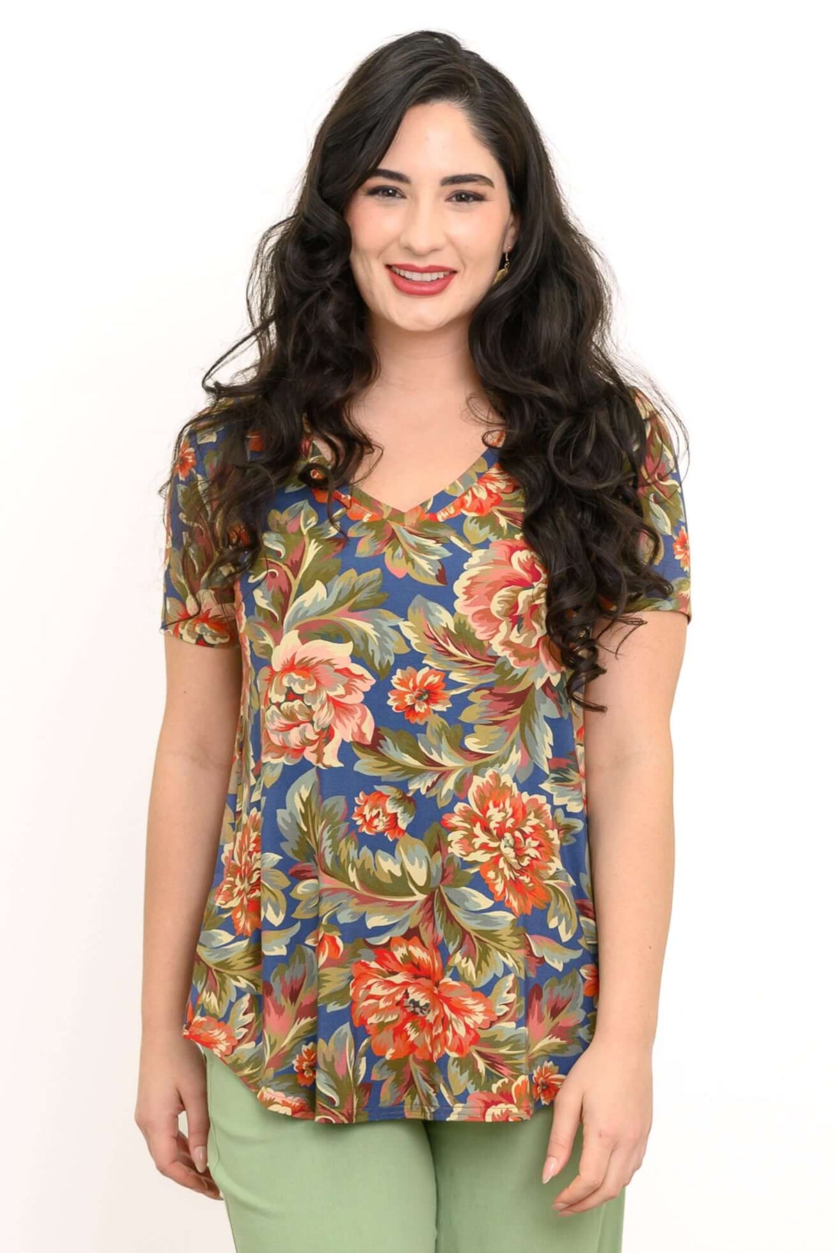 Woman wearing a Jackie Bamboo V-Neck Top with colorful floral print