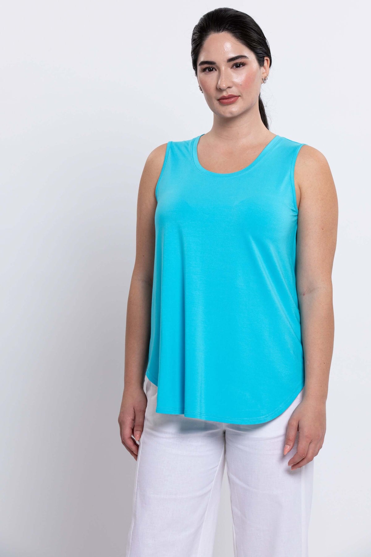 Woman wearing aqua blue bamboo tank top with relaxed fit