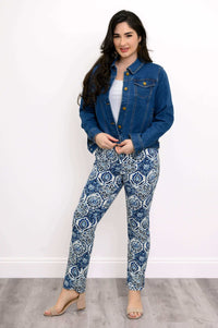 Woman wearing blue and white indigo mosaic slim pants with denim jacket