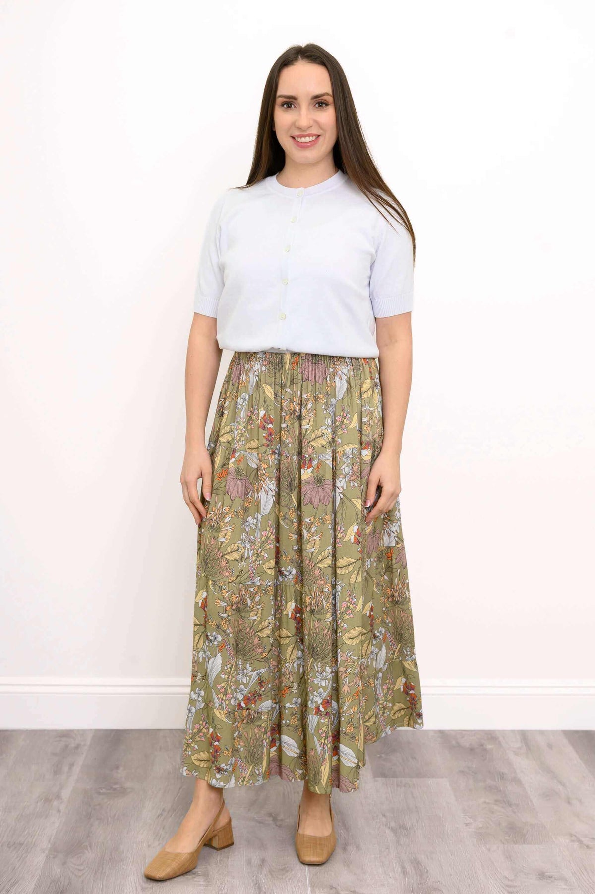 Woman wearing floral Roma skirt, full outfit front view