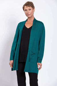 Woman wearing teal open-front cardigan with black top and pants, front view