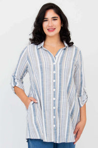 Front view of model wearing a blue and white striped oversized tunic shirt with 3/4 sleeves