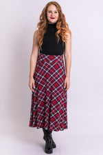 Women's long red plaid high-waisted skirt with wide waistband and pockets.