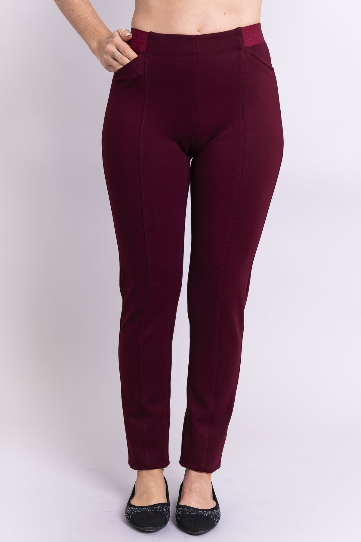 Front view of women's petite burgundy tailored pant, with slim and narrow leg. Made of sustainable and natural bamboo fibers, fair-trade.