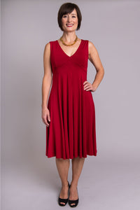 Women's burgundy red sleeveless fitted bodice short dress with V-neck, made with natural bamboo fibers.