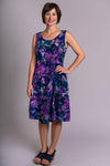 Women's purple palace print sleeveless short summer dress with fitted bodice and round neckline.