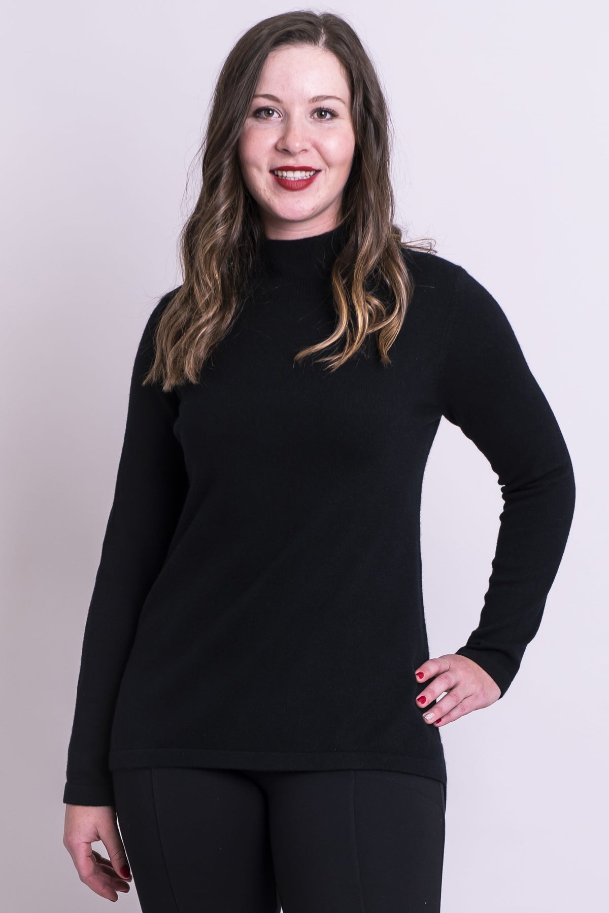 Women's black long-sleeve mock neck sweater, made with natural wool and cashmere fibers.